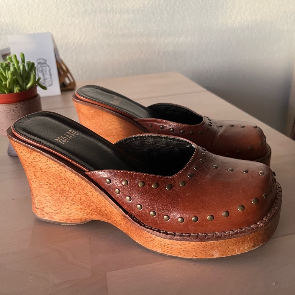 Gorgeous leather Pegabo clogs with brushed brass rivets. 4 inch wooden heel.